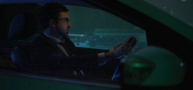 Man answering phone call while driving