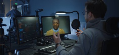 Programmers talking via a VoIP call