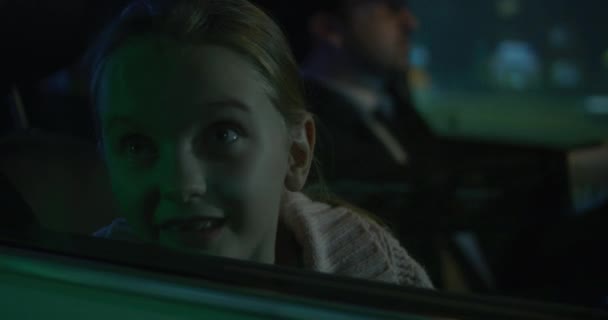 Girl pushing face against car window — Wideo stockowe