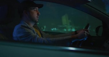 Man answering phone call while driving