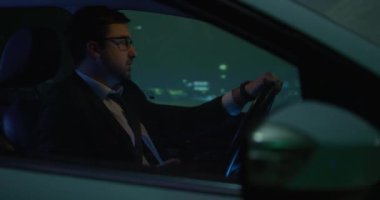 Man answering phone call while driving