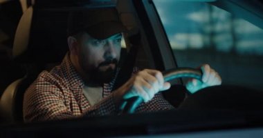 Sleepy man slapping himself while driving