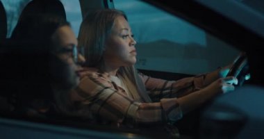 Mother and daughter talking while traveling