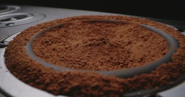 Cocoa powder vibrating on subwoofer — Stock Video
