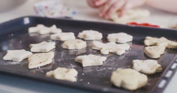 Man decorating cakes before baking — Stock Video