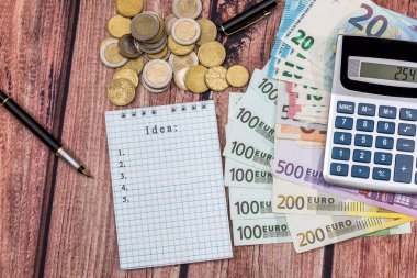 Fikir Word'de Euro, hesap makinesi, bozuk para ve kalem ile not etmek.