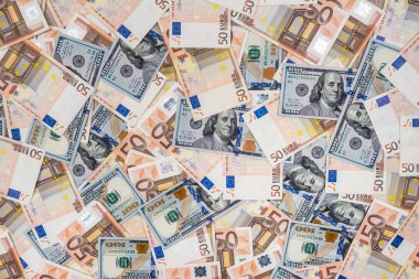 arka plan olarak 50 wuro ve 100 dolarlık banknotlar