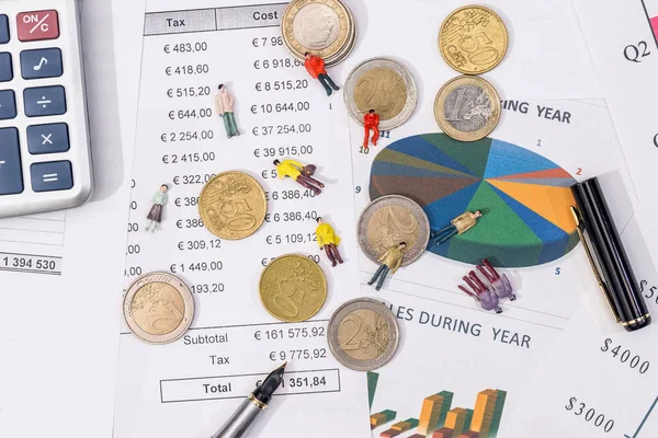 amsll toy people with euro coin and business graph.