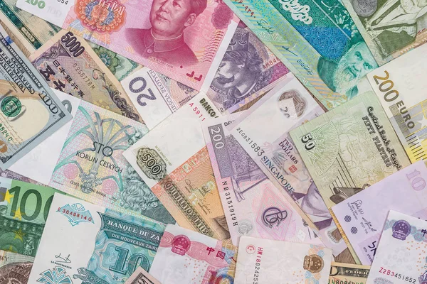 来自世界各国的许多不同货币纸币的背景 — 图库照片