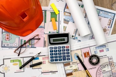 Turuncu kask, İnşaat çizim, hesap makinesi, kalem