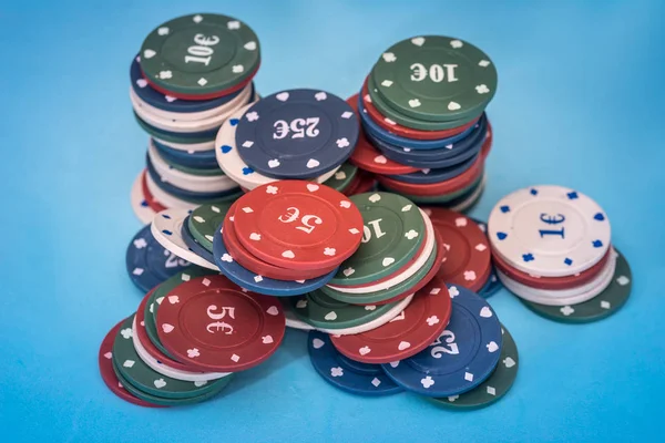 Many Poker Chips Isolated Blue Background — Stock Photo, Image