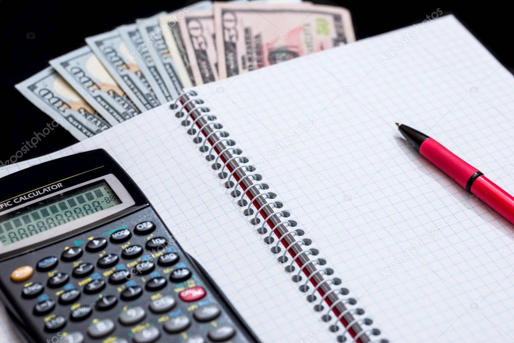 Business concept, calculator, pen, notebook  and money