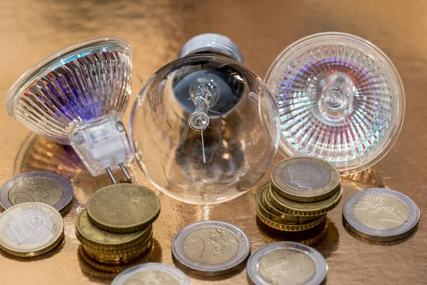 light bulb with coin. close up