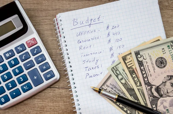 Home budget with money,  pen and calculator