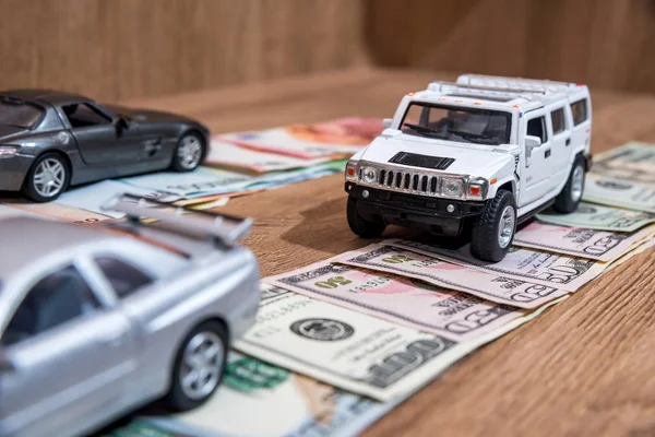 toy cars on money road