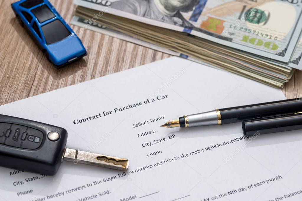 car contract form, pen and dollar