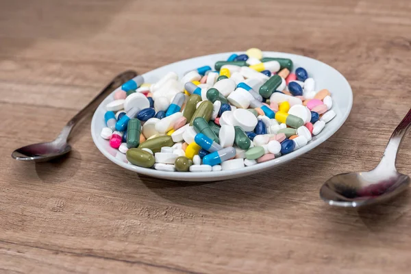 Colorful Pills Plate Spoon Wooden Background — Stock Photo, Image