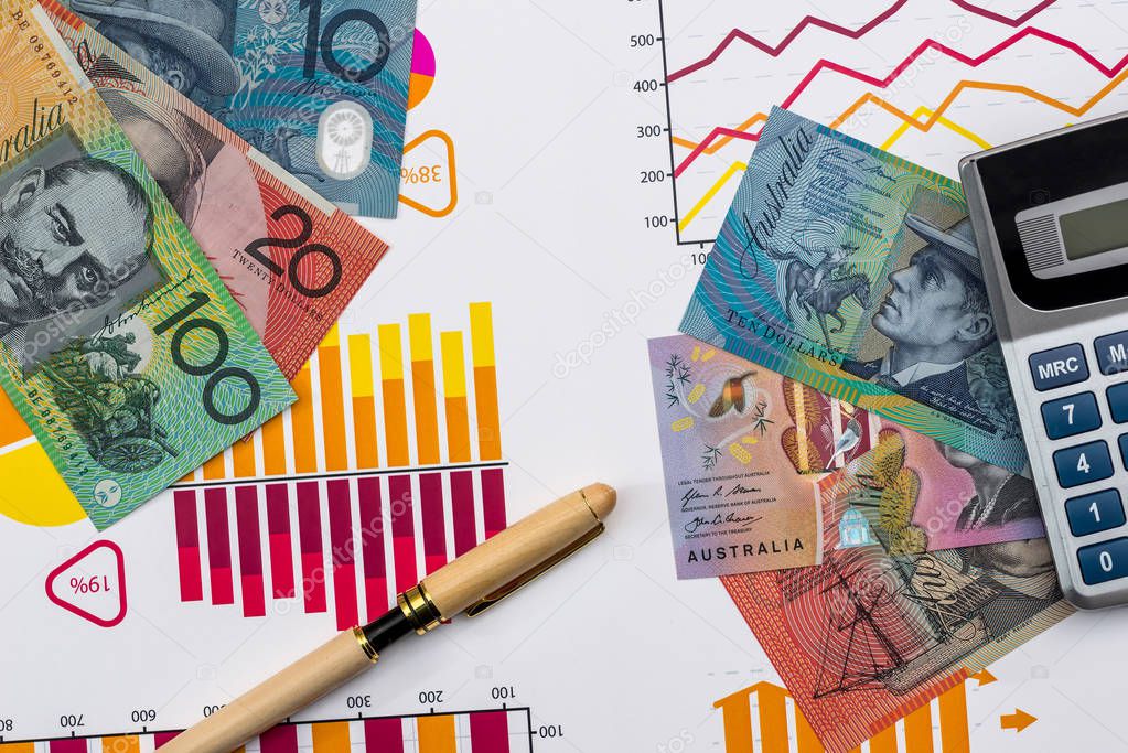 Australian dollar on business graph with calculator and pen