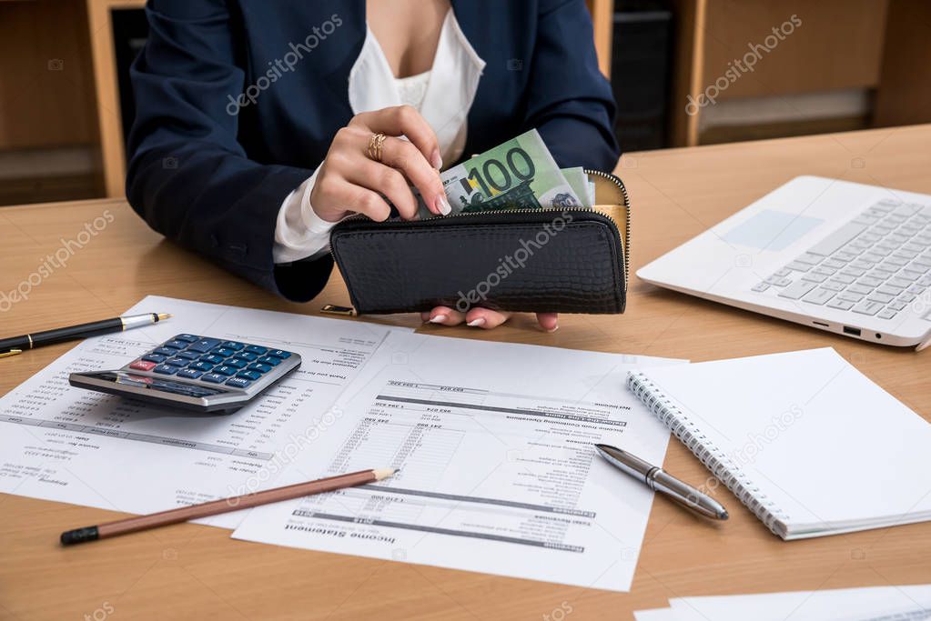 woman hands counting euro money  with document home budget lapptop pen and calculator
