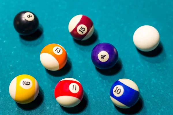 Billiard balls on blue table, close up