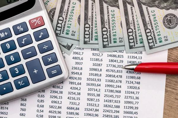 investment or accounting concept - money and calculator