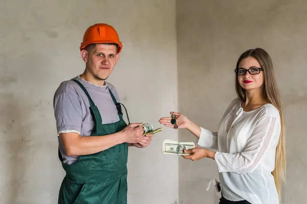 Exchange between man builder with keys and woman with money