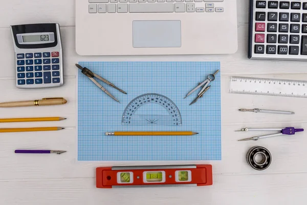Engineer's workplace with millimeter paper and draw equipment — 스톡 사진