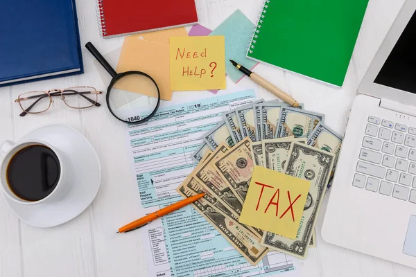 Tax declaration with dollars and coffee top view — Stock Photo, Image