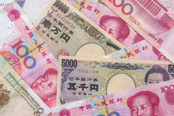 Chinesischer Yuan Mit Japanischem Yen Als Hintergrund — Stockfoto