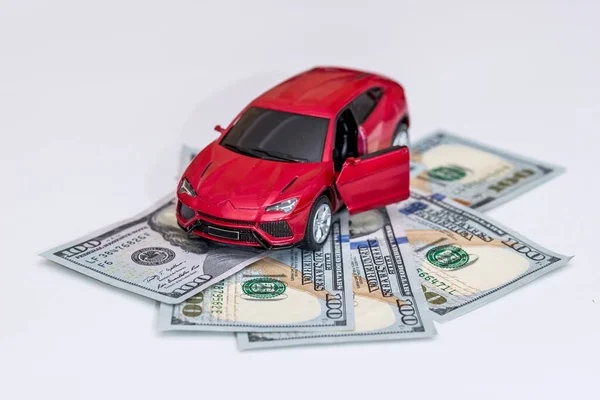 red toy car with money isolated