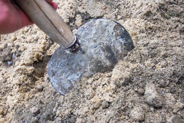 Mixing a cement powder with sand