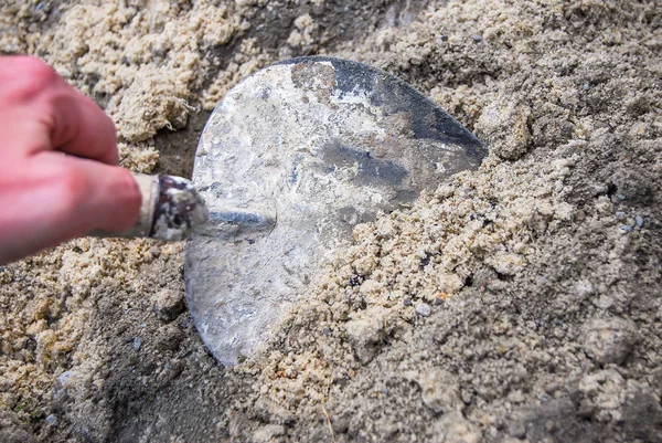 Mixing a cement powder with sand