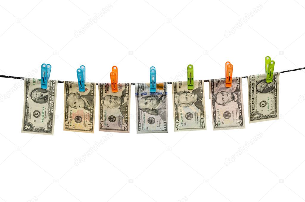 set of us dollars from 1 to 100 are drying on cord isolated on white background