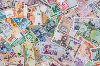 World banknotes collection mixed on table, top view