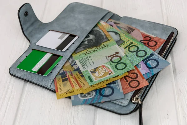 Australian dollars with credit cards in wallet