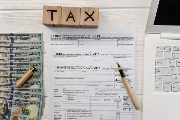 1040 Tax Form Dollar Laptop Wooden Cubes — Stock Photo, Image