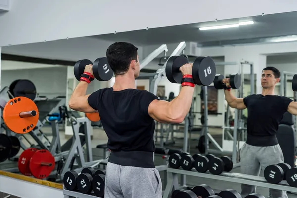 Athlete Man Lifting Dumbbell Gym Back View — Stock Photo, Image