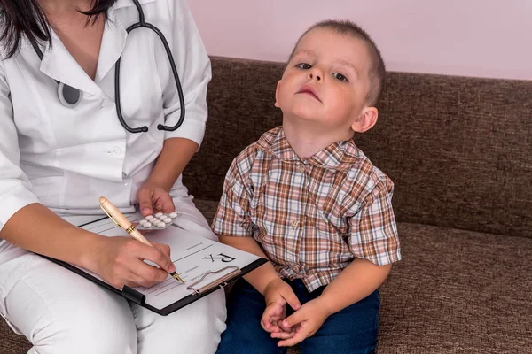 Doctor Filling Prescription Little Boy Sitting — Stock Photo, Image