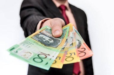 Man holding australian dollar banknotes close up clipart