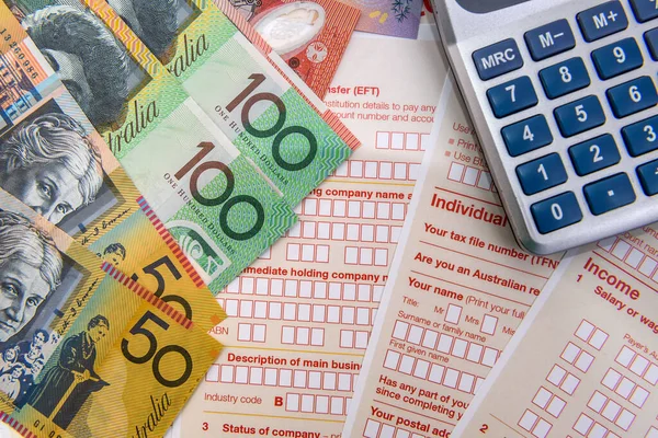 Australian dollars with calculator on tax form
