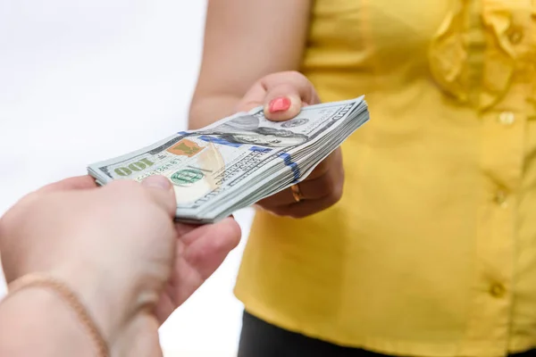 Kvinna Tar Dollar Högen Från Manlig Hand Närbild — Stockfoto