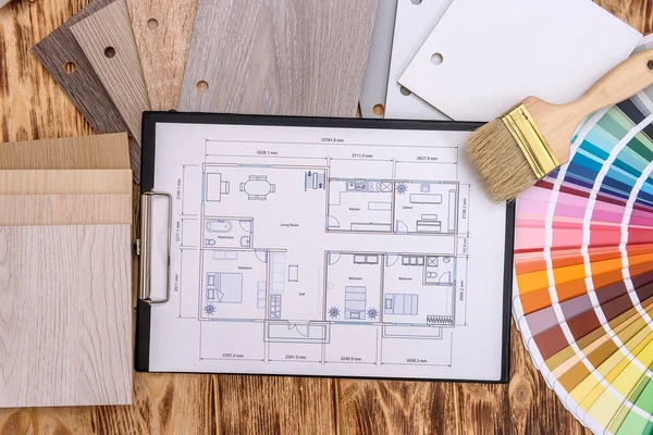 House project with different design tools on table