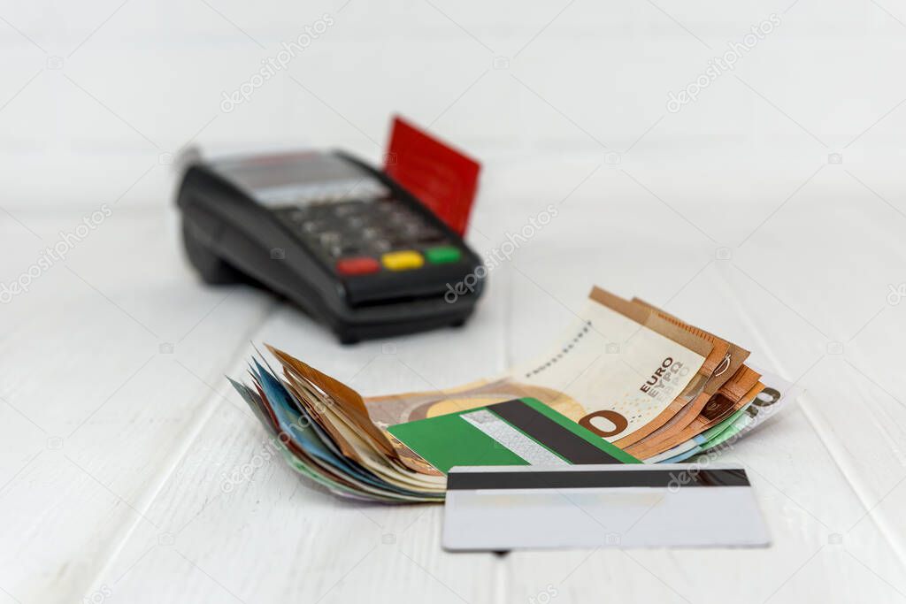 Selective focus on euro banknotes with credit card