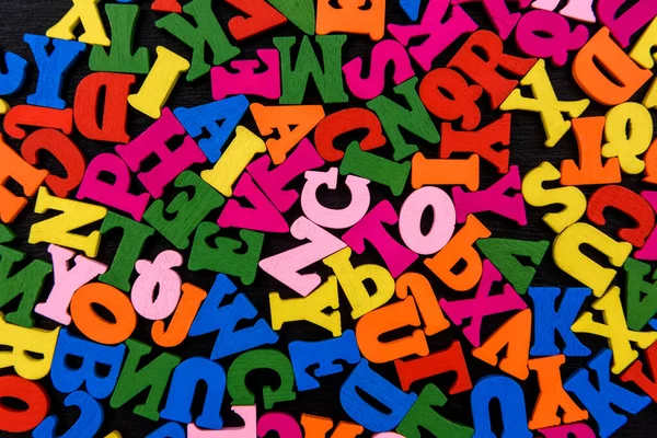Colorful wooden letters, alphabet, close up .