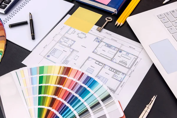 Color swatch with architectural drawing on table