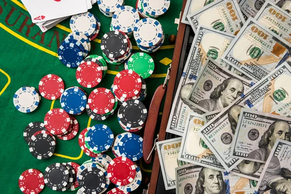 Super casino win! a case stuffed with dollars with poker chips to exchange on the gaming table