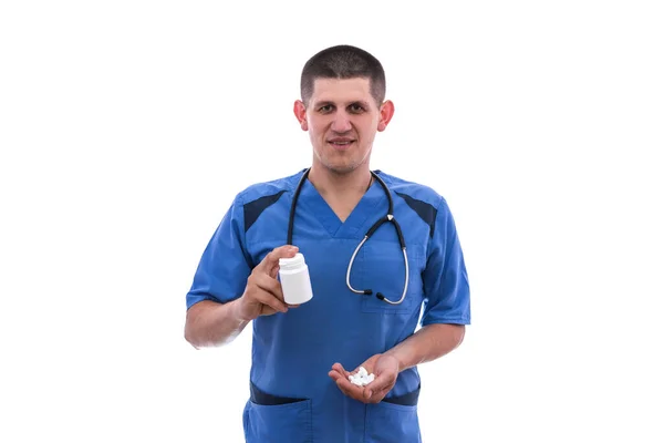 Mavi Üniformalı Genç Doktor Beyaz Arka Planda Izole Edilmiş Kavanozlardan — Stok fotoğraf