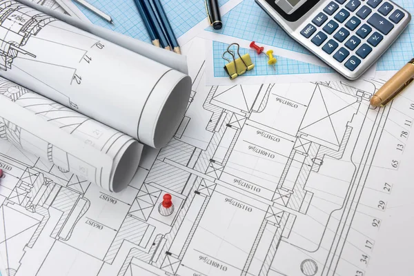 Technical drawing with millimeter paper and drawing tools. Mathematics and engineering