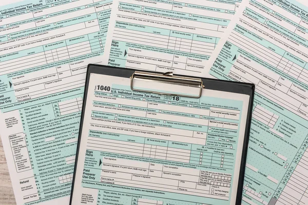 1040 individual us tax form with pen.