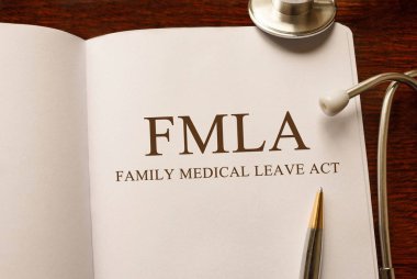 Page with FMLA Family Medical Leave Act on the table with stethoscope, medical concept clipart